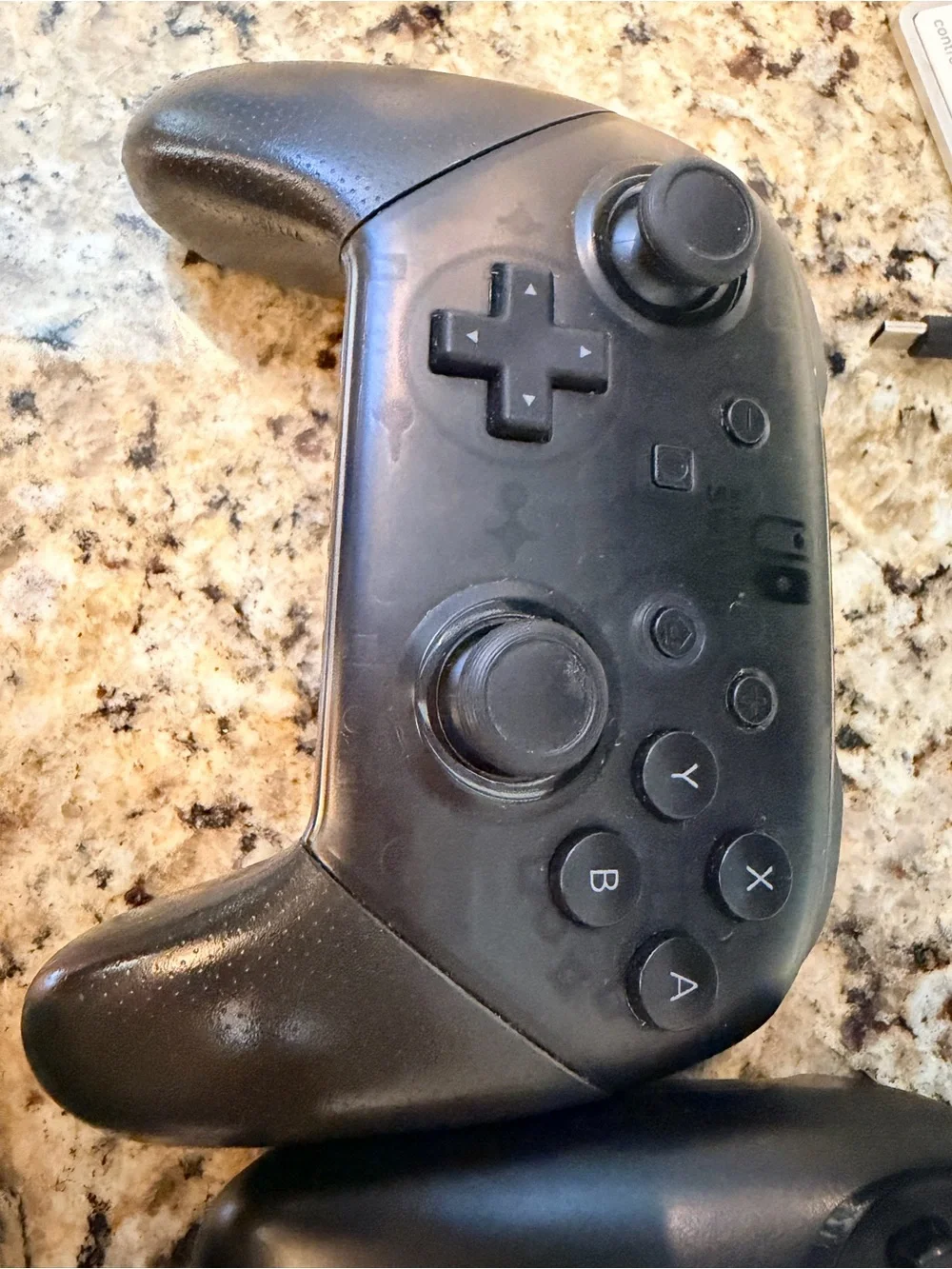 2 steel nimbus controllers and 1 Nintendo switch pro controller
